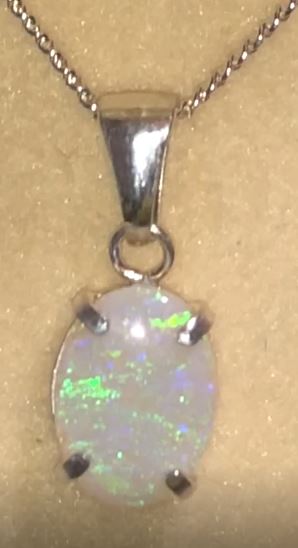 Beautiful green and blue crystal opal set in solid silver pendant