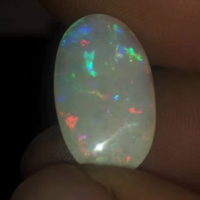 Large multi-coloured white opal gemstone