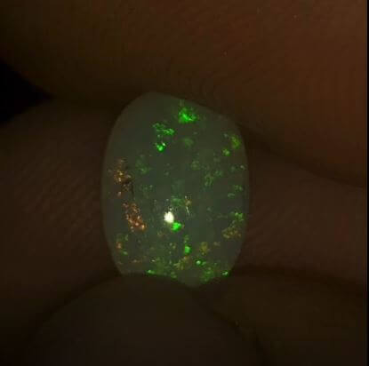Coober Pedy crystal opal displaying green and orange colours
