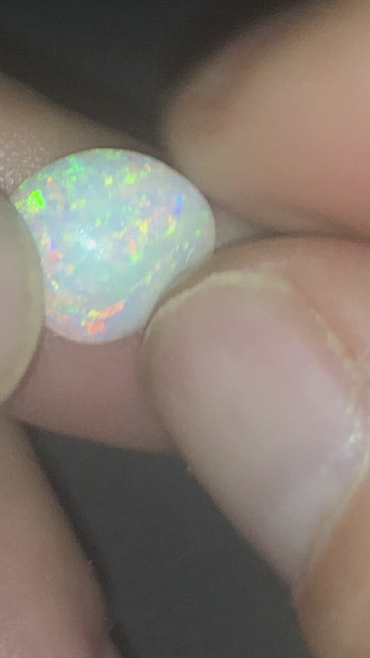 Crystal opal freeform showing a rainbow of colours
