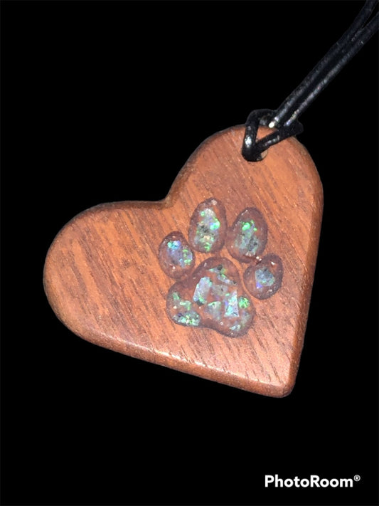 Timber heart pendant with a paw print inlaid with chips of Coober Pedy opal