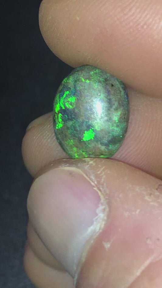 Gorgeous floral pattern of green in this oval shaped matrix opal