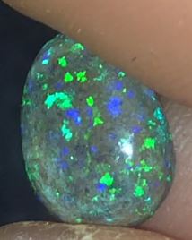 Green and purple pear shaped matrix opal