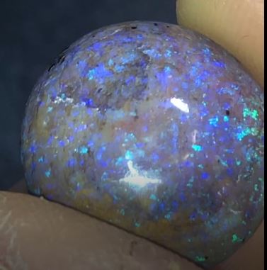 Large purple and green matrix opal.