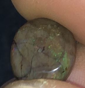 Subtle patterns of colour in this earthy matrix opal