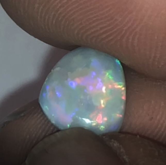 Purple, green and orange opal from Coober Pedy.