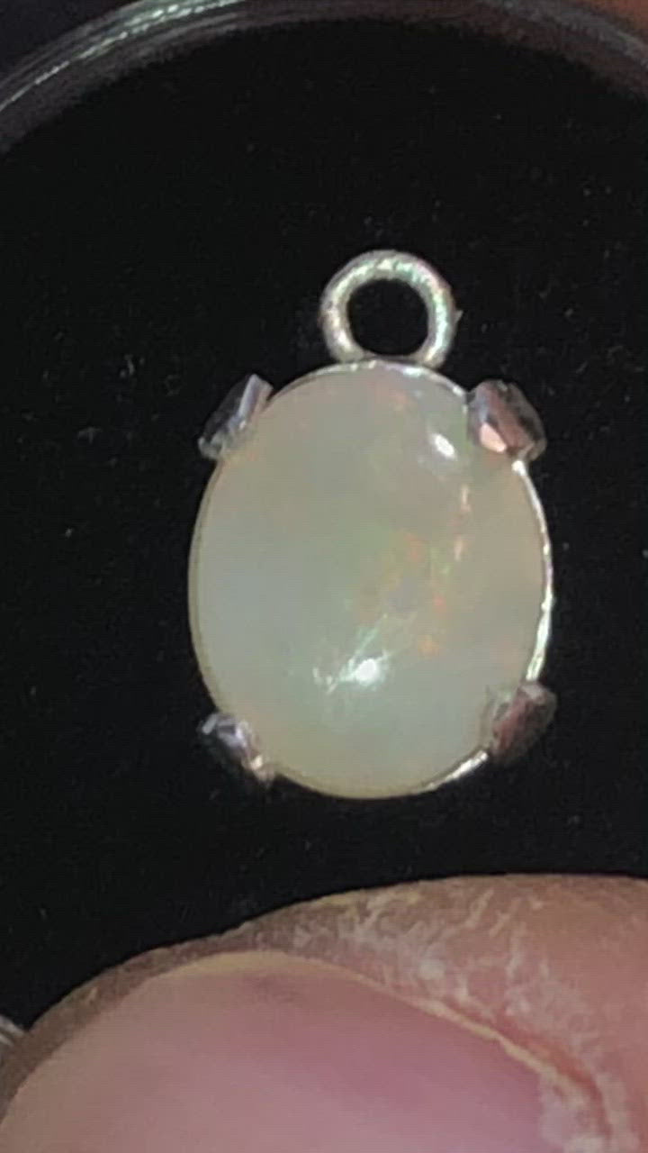 Pastel red in this white opal pendant