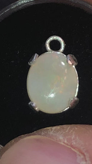 Pastel red in this white opal pendant