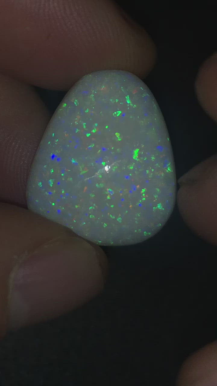 Large Coober Pedy sparkler. 24.15 carat opal displaying purple, green and pink colours