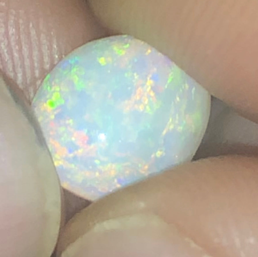 Crystal opal freeform showing a rainbow of colours